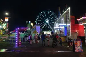 Full view of the Ferris Wheel and other games and amusement rides at the 200th Annual Schaghticoke Fair