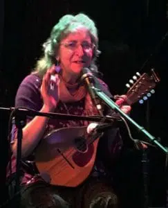 Deb Cavanaugh playing mandolin at the Eden Cafe.
