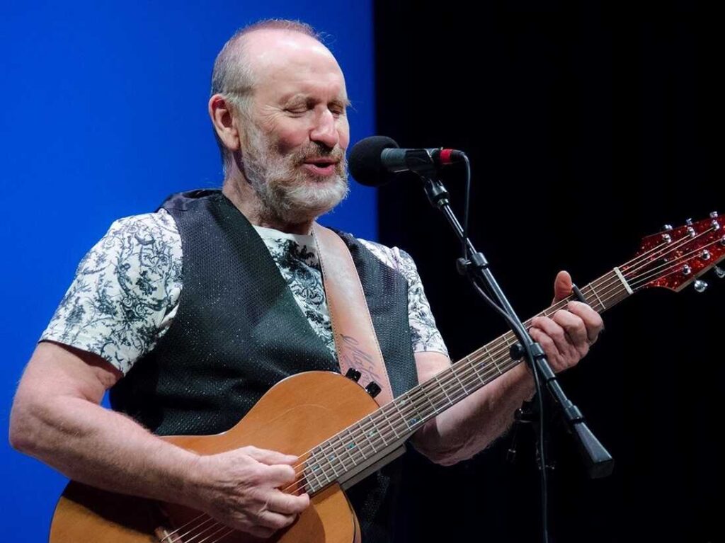 Colin Hay playing guitar